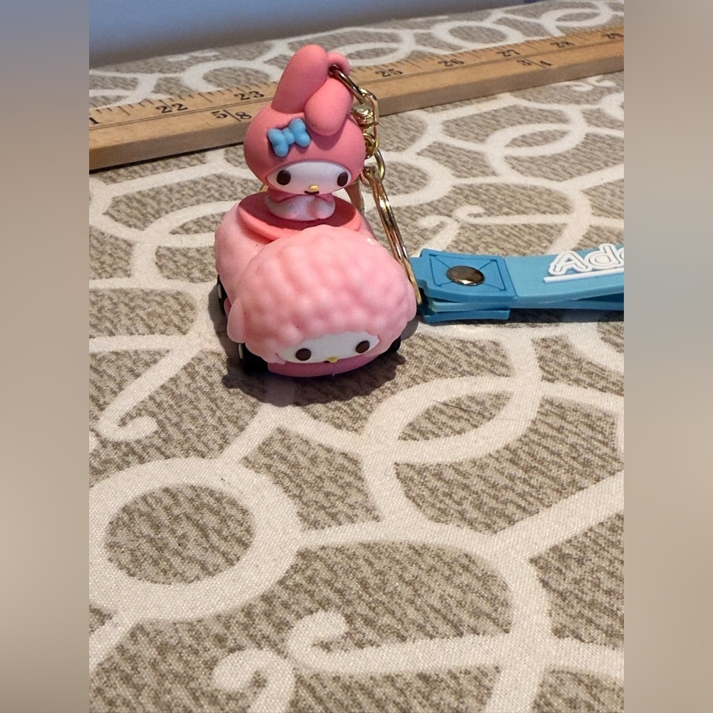 Melody keychain featuring My Melody in a mini bumper car